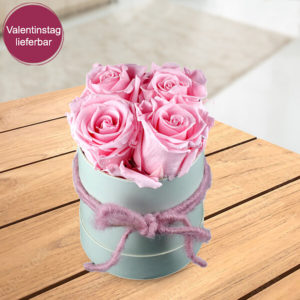 4 rosa haltbare Rosen in Hutschachtel